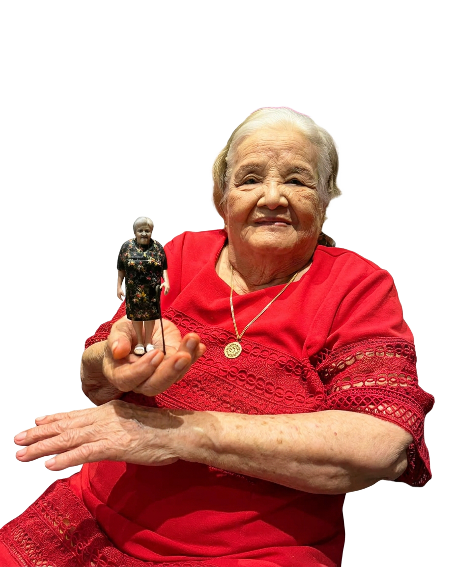 Inang holding her full-color 3D printed Mini Yu figurine